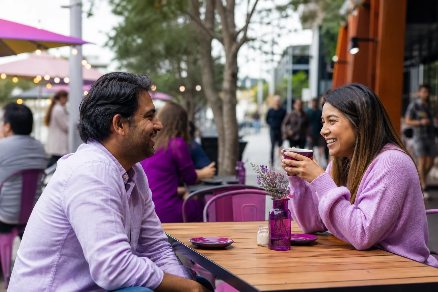 Two people talking beside the Swan River in Perth, Western Australia